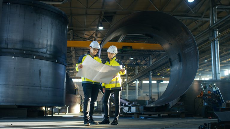 https://morgangray.com/wp-content/uploads/2022/08/male-and-female-industrial-engineers-look-at-project-blueprints-while-standing-surround-by-pipeline-400x225.jpg